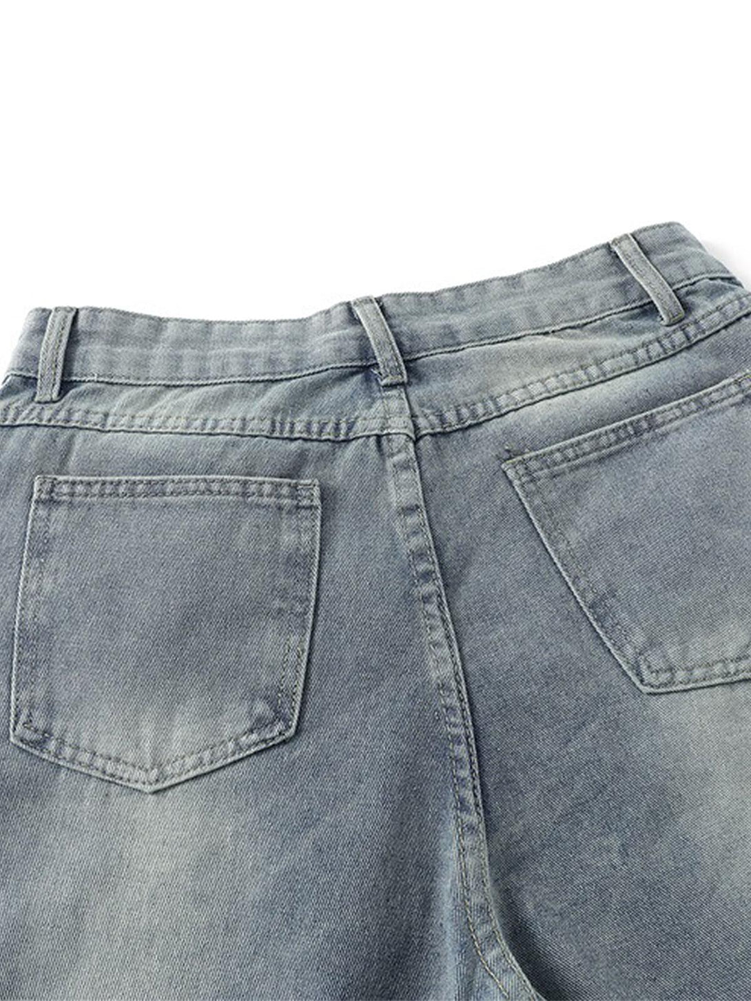 Back view of TALISHKO distressed baggy jeans, showcasing raw edge and relaxed denim fit.
