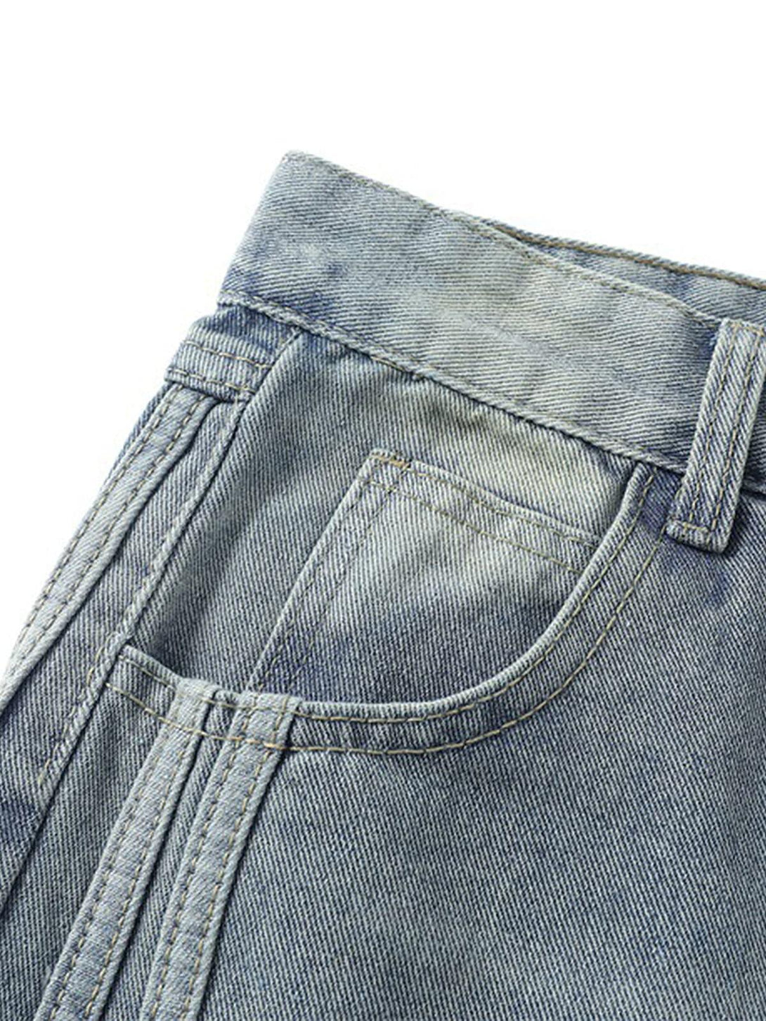 Detailed view of TALISHKO distressed baggy jeans pocket, highlighting raw edge and stitching.