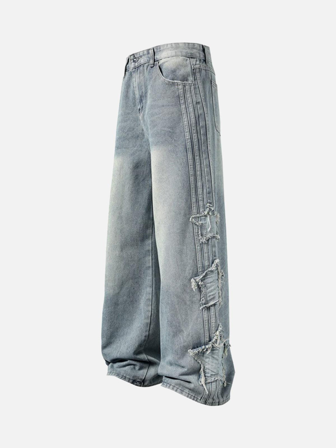 Side view of distressed baggy jeans by TALISHKO, showcasing raw edge details and relaxed fit.