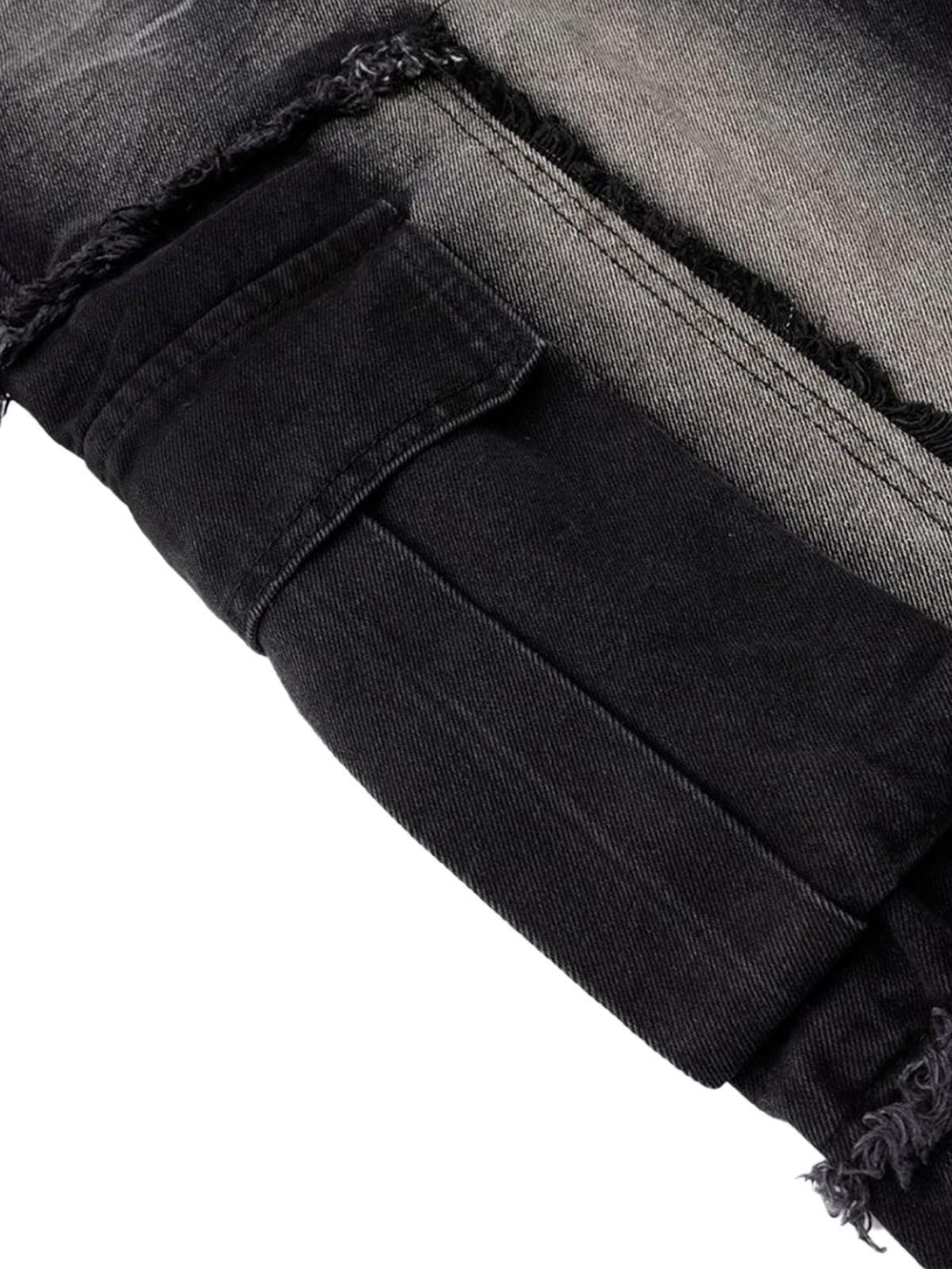 A tight crop highlighting TALISHKO's distressed barrel jeans with raw edge detailing.