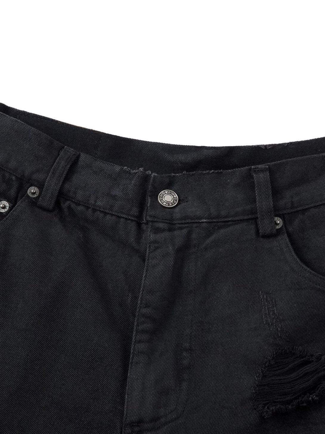 Close-up of TALISHKO black denim shorts highlighting the button and distressed details.