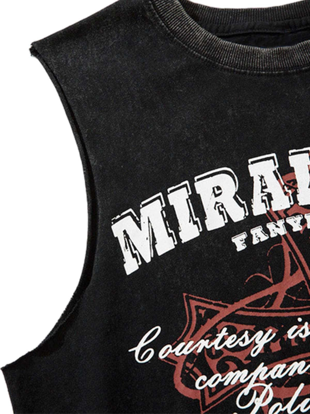 A close-up of a TALISHKO vest with distressed fabric and bold graphic lettering.