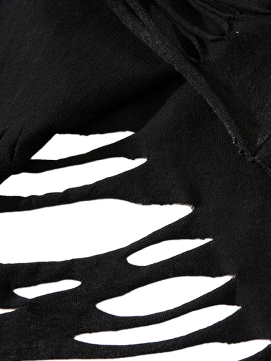 Zoomed-in view of distressed fabric with ripped details on a vest by TALISHKO.