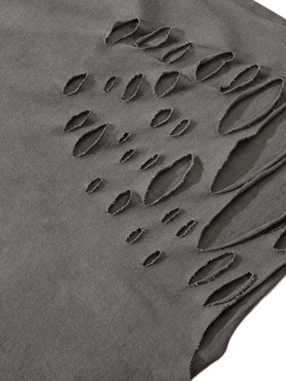 A tight crop highlighting the distressed ripped detail on a vest by TALISHKO.