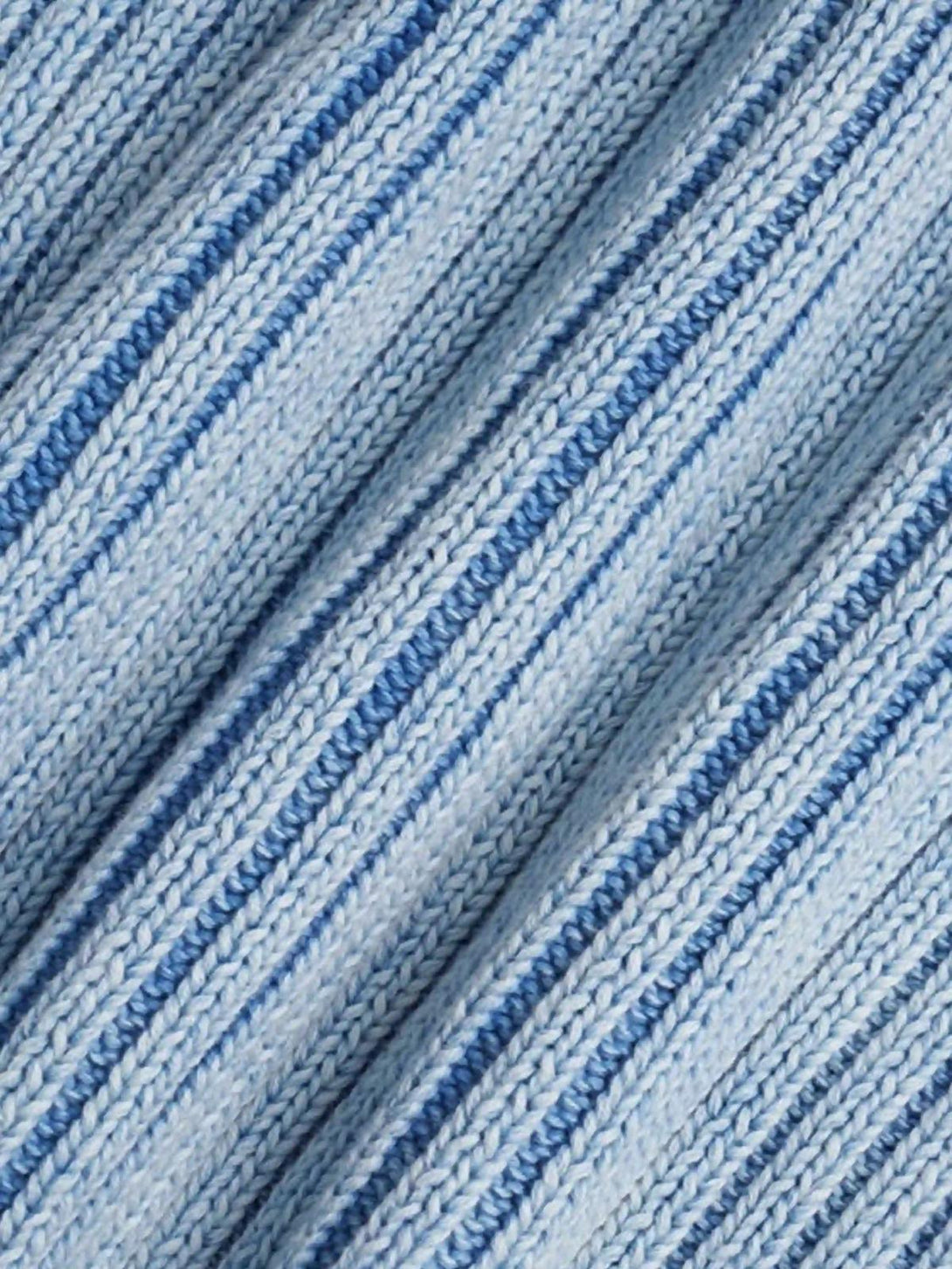 A detailed view of the knit texture in a blue sweater, crafted by TALISHKO.