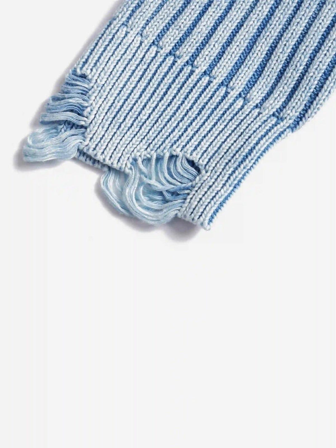 Zoomed-in texture of the blue distressed sweater's ripped details, crafted by TALISHKO.