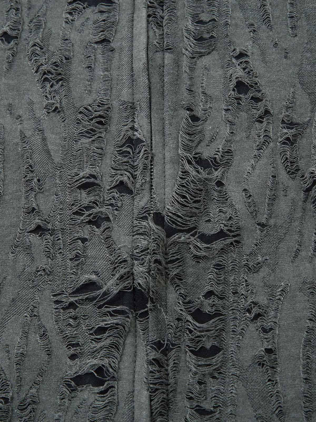 "Texture and pattern showcased on a TALISHKO distressed short sleeve shirt, highlighting intricate details."