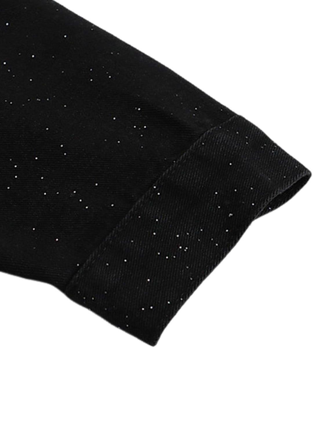 Detailed sleeve view of TALISHKO's distressed denim jacket with sparkly sequin accents.