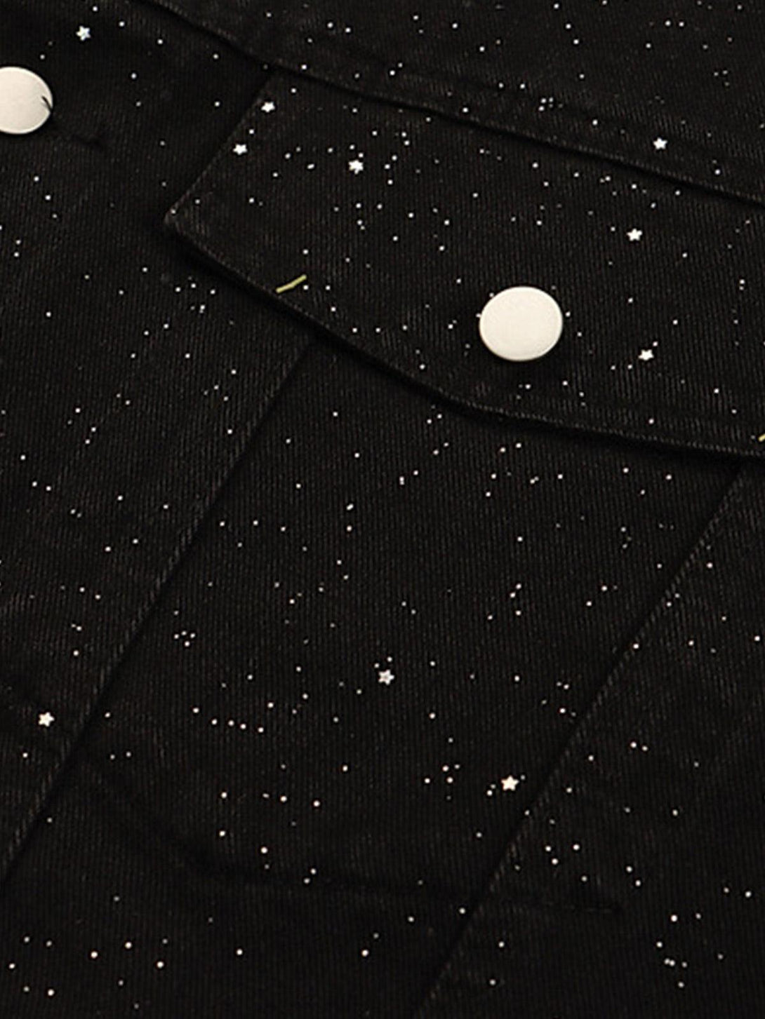 Intricate design detail of TALISHKO's distressed denim jacket with a starry sequin pattern.