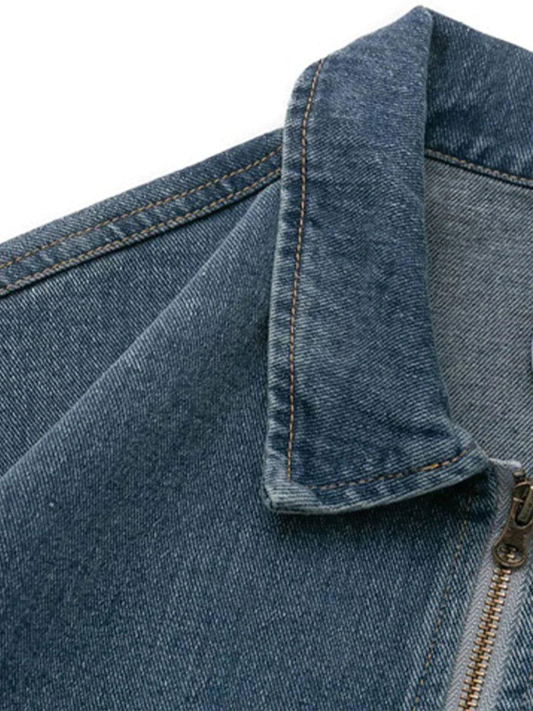 A detailed view of the TALISHKO denim jacket's collar and stitching, showcasing its classic design.