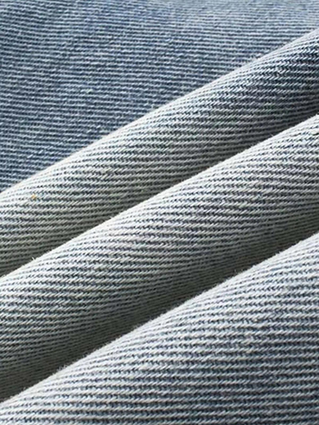 Texture and pattern showcased on TALISHKO jeans, highlighting unique distressed fabric.