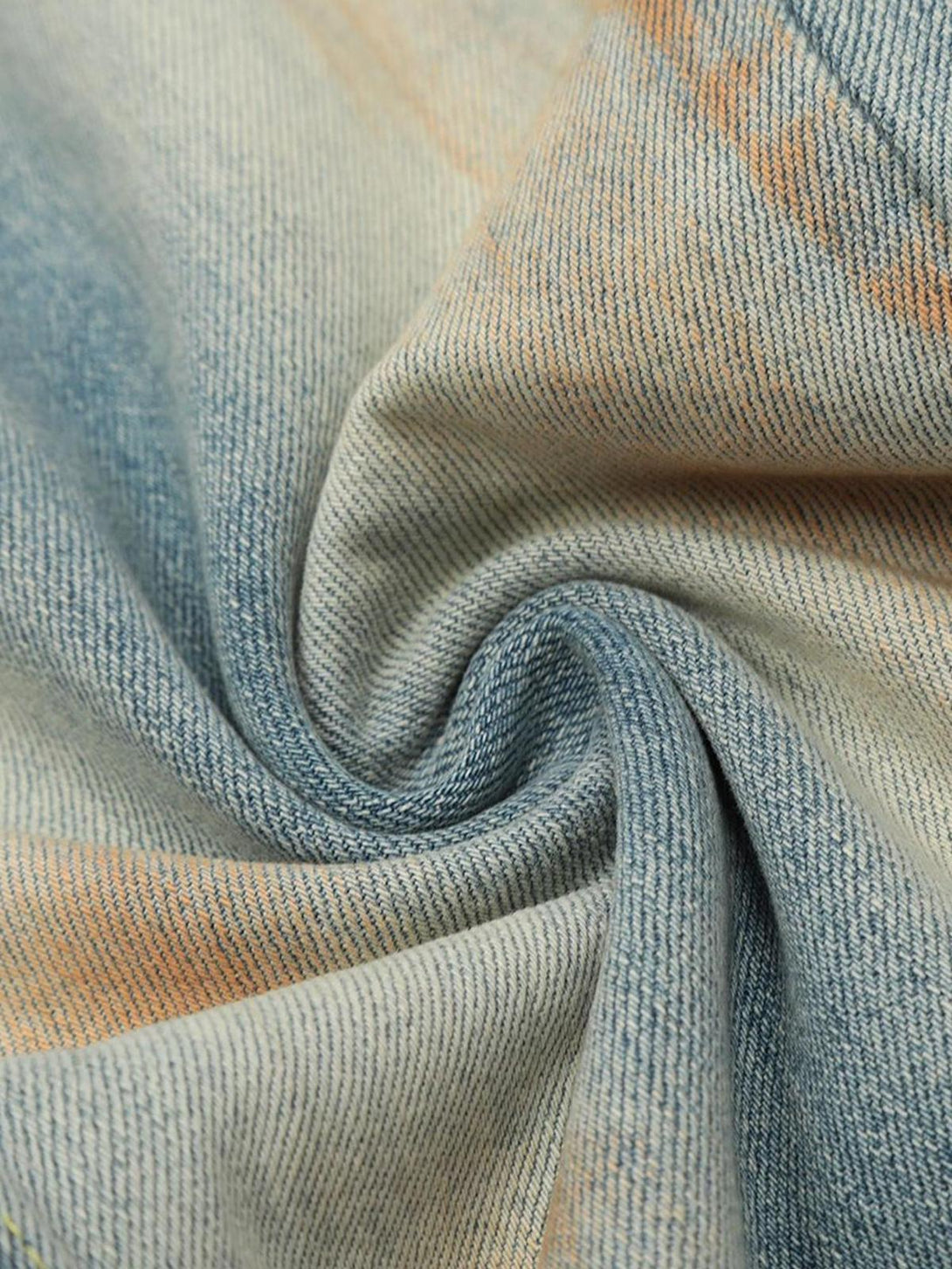 Texture and pattern showcased in TALISHKO's distressed hip-hop jeans, highlighting denim details.