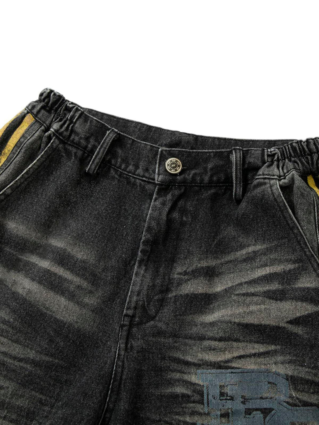 Detailed view of TALISHKO jeans highlighting distressed texture and stylish side stripes.
