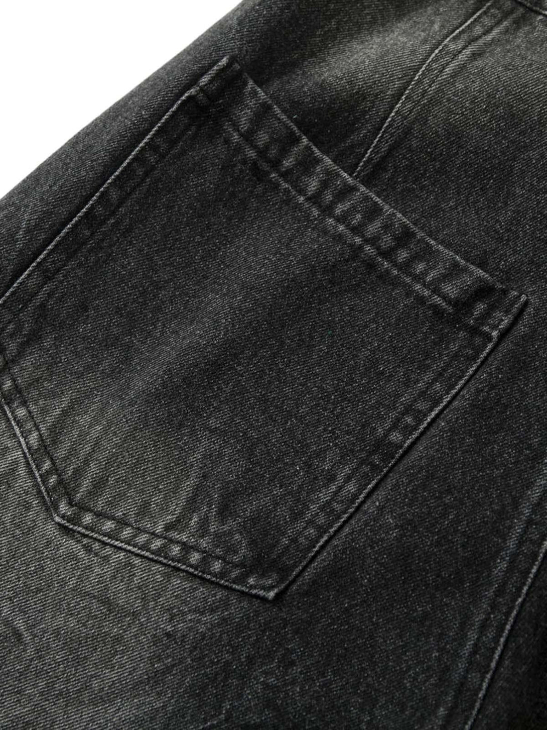 Detailed fabric and stitching on TALISHKO jeans, highlighting the black denim pocket design.