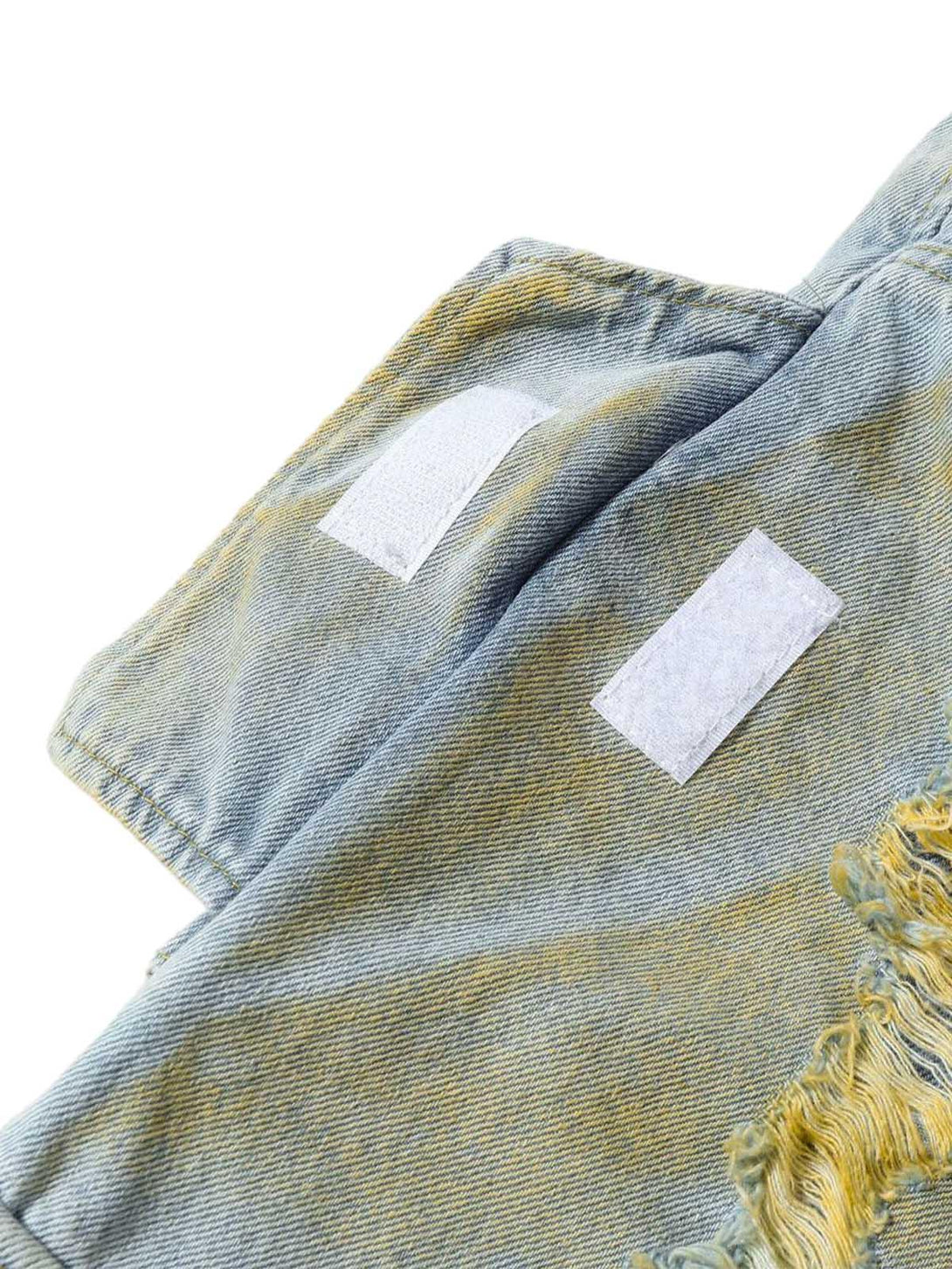 Focusing on TALISHKO distressed tie-dye denim shorts, showcasing unique frayed detailing.