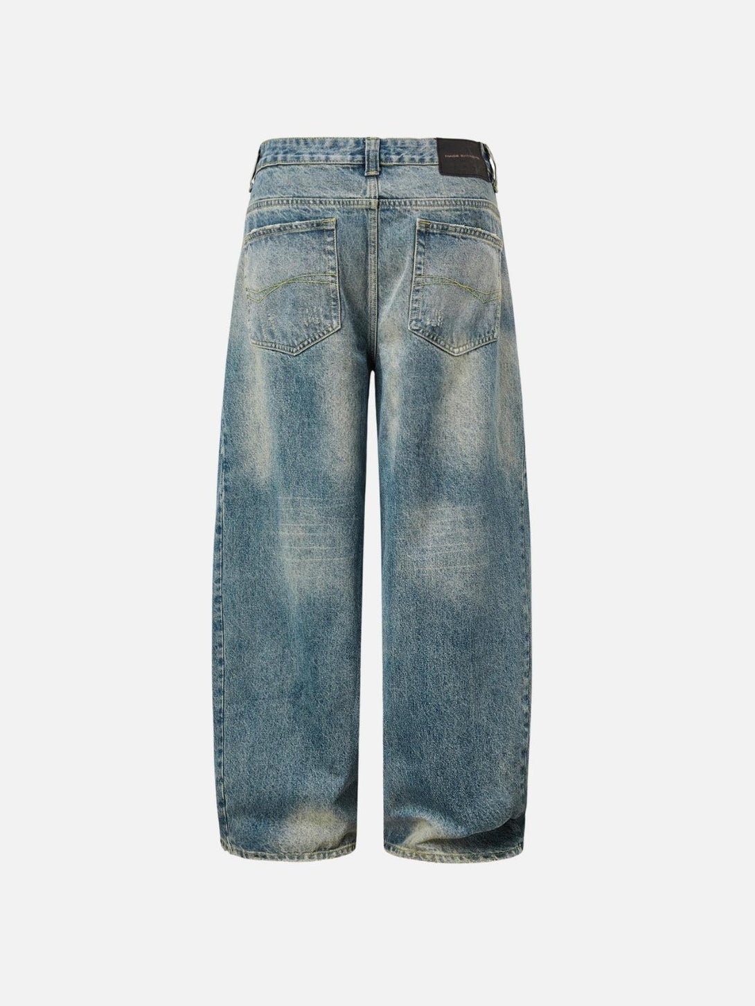 Back view of TALISHKO distressed washed barrel jeans, highlighting a relaxed vintage fit.