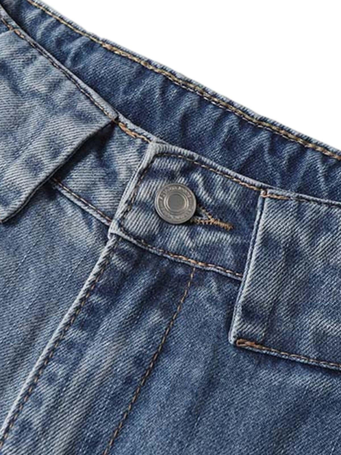 A detailed view of TALISHKO's distressed denim, highlighting intricate stitching and button detail.