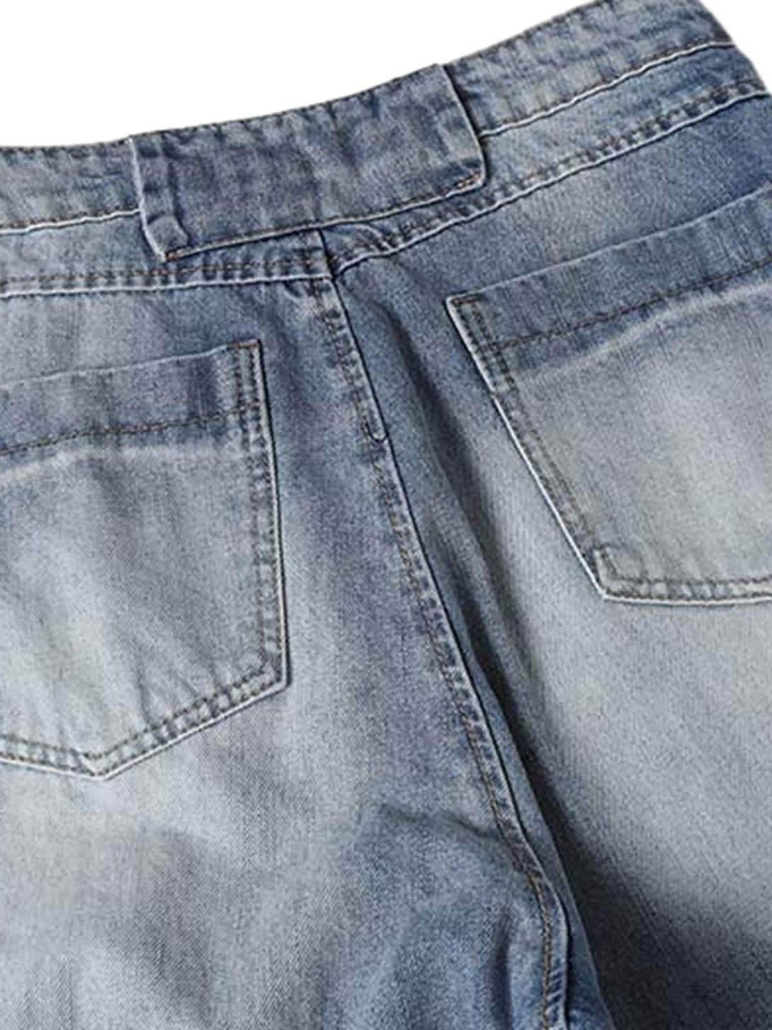 Back view of TALISHKO's deconstructed barrel jeans, highlighting the faded denim pockets.