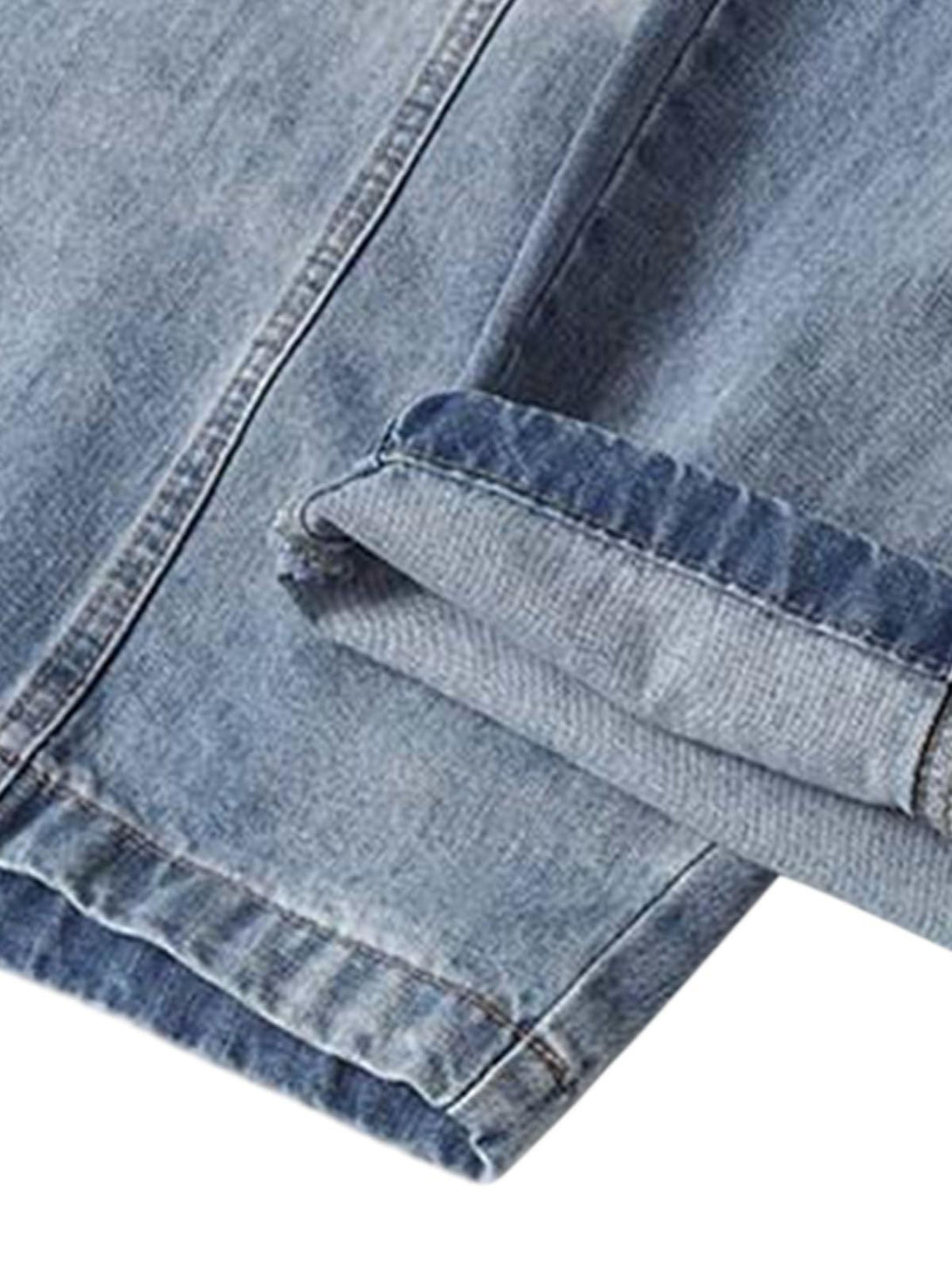 Detailed fabric and stitching of TALISHKO's deconstructed barrel jeans, highlighting texture.