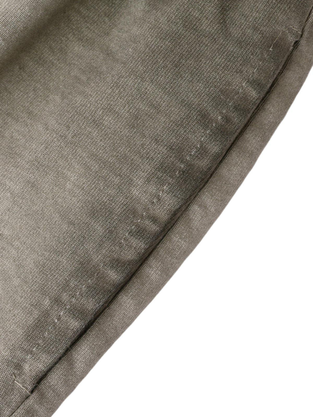 A detailed view of TALISHKO drawstring shorts, highlighting the distressed washed texture.