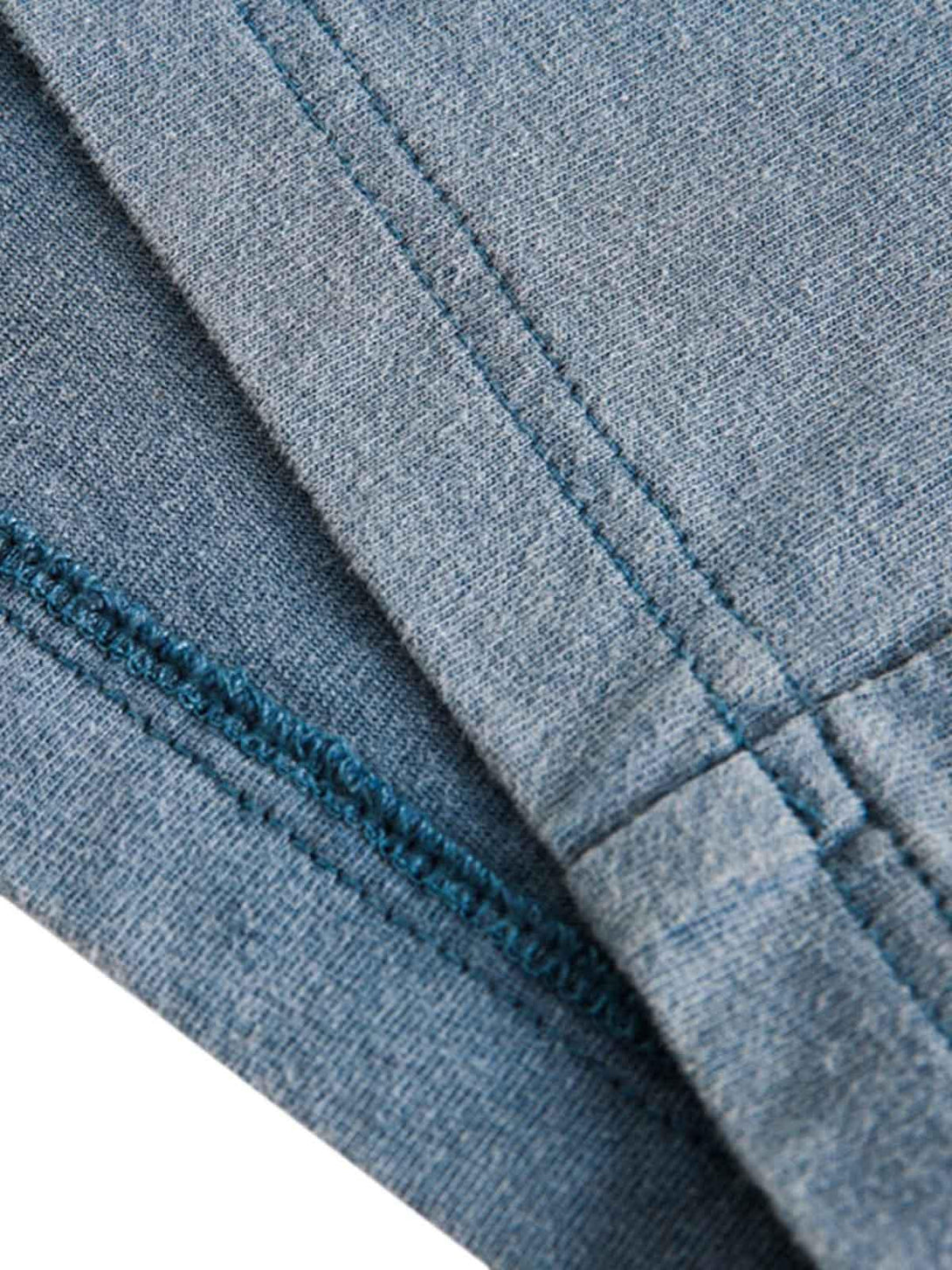 "Detailed fabric and stitching of TALISHKO's gradient vest, showcasing its distressed look."