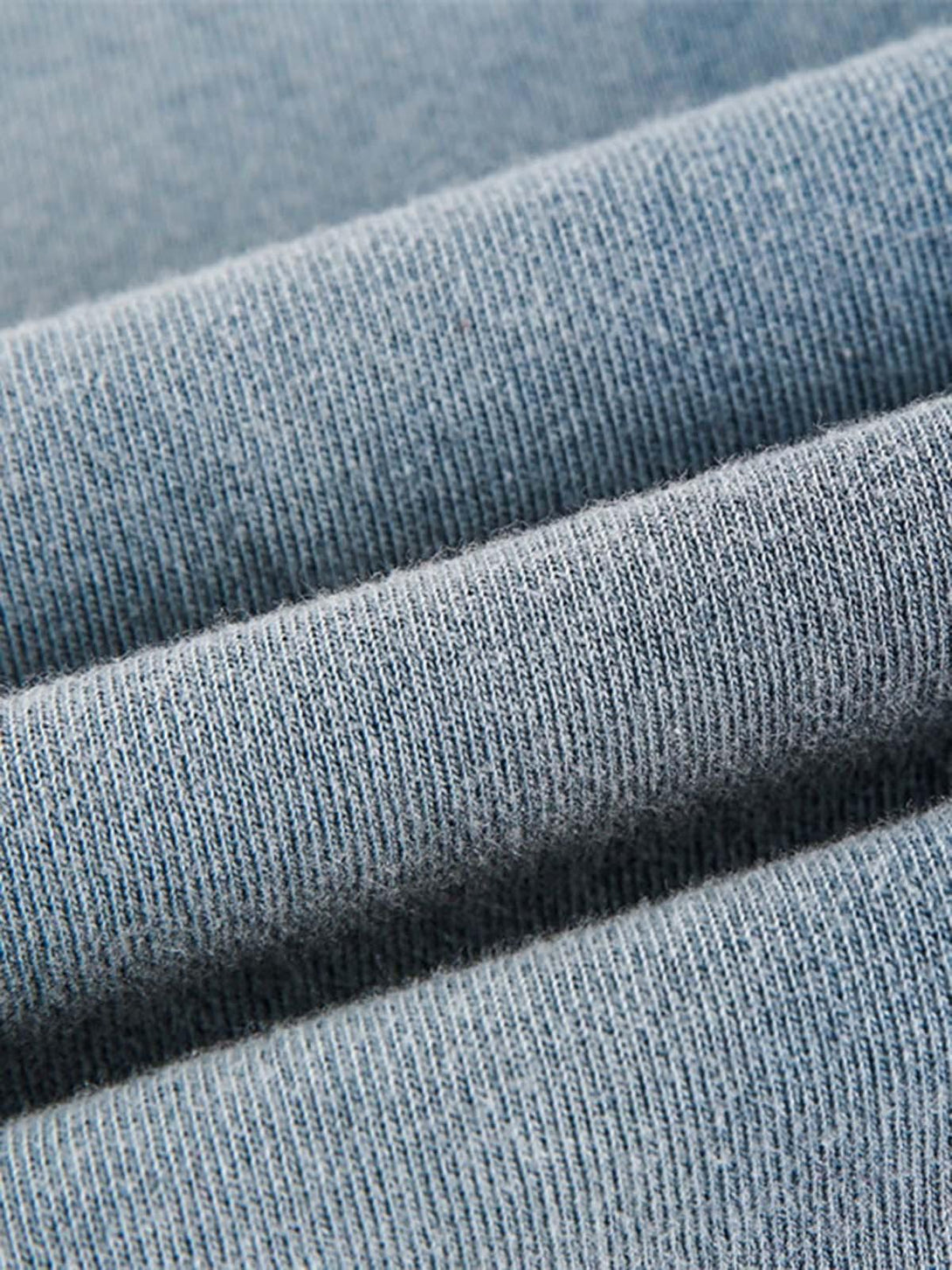 Intricate look at TALISHKO's gradient vest fabric, showcasing its soft, distressed texture.