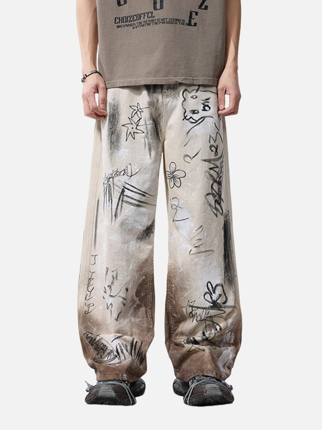 Model wearing TALISHKO graffiti baggy jeans, highlighting a unique and creative fashion style.