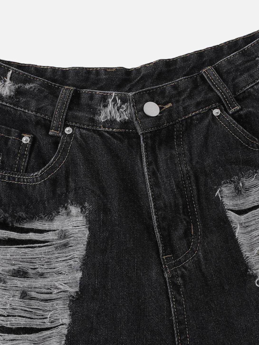 A detailed look at TALISHKO distressed jorts, highlighting the rugged, washed black denim texture.