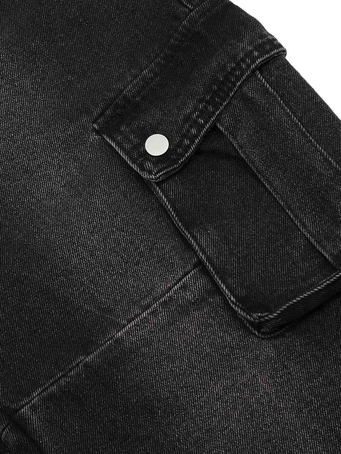 Close-up of TALISHKO cargo jeans' pocket, showcasing the rugged texture and utility snap closure.