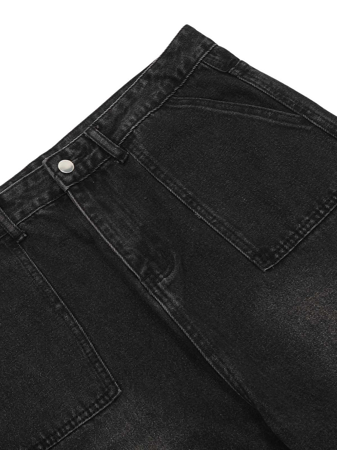 A detailed view of TALISHKO cargo jeans, focusing on the distressed wash and pocket design.