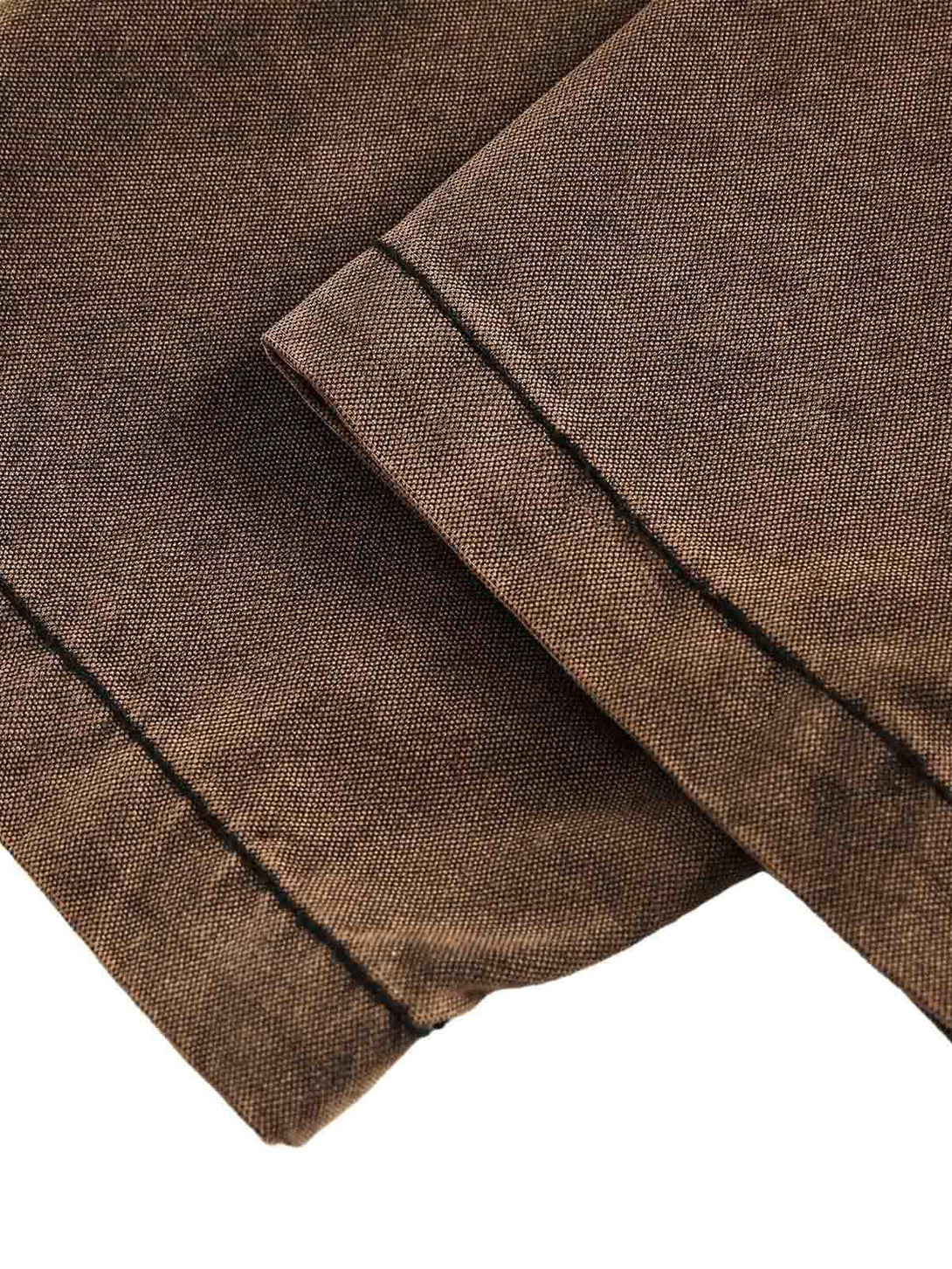 Detailed fabric and stitching highlighted on TALISHKO's distressed denim sweatshirt.