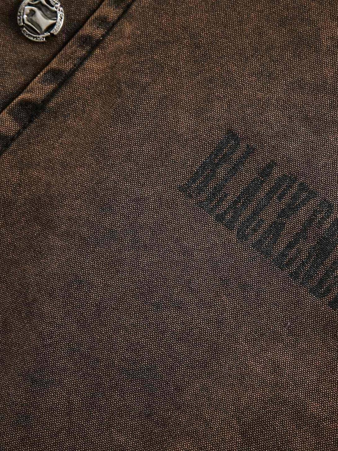 Detailed fabric and rivet button on TALISHKO's distressed washed denim sweatshirt.