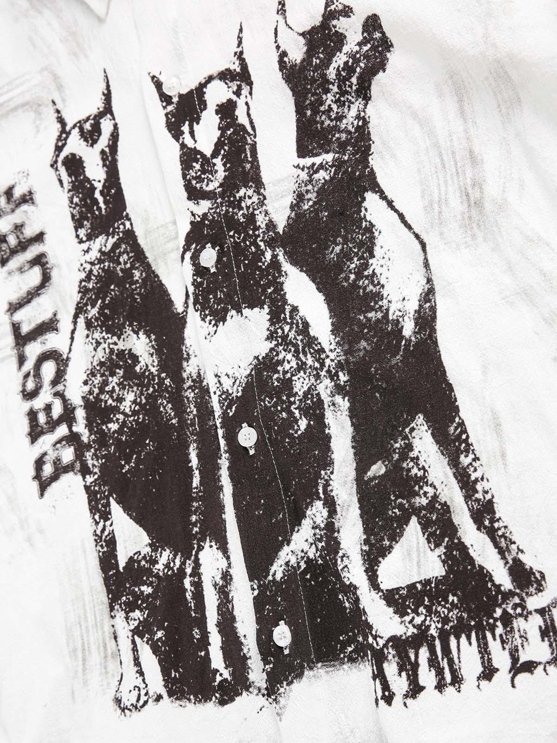Detailed look at TALISHKO's Doberman print on a short sleeve shirt, highlighting unique design.
