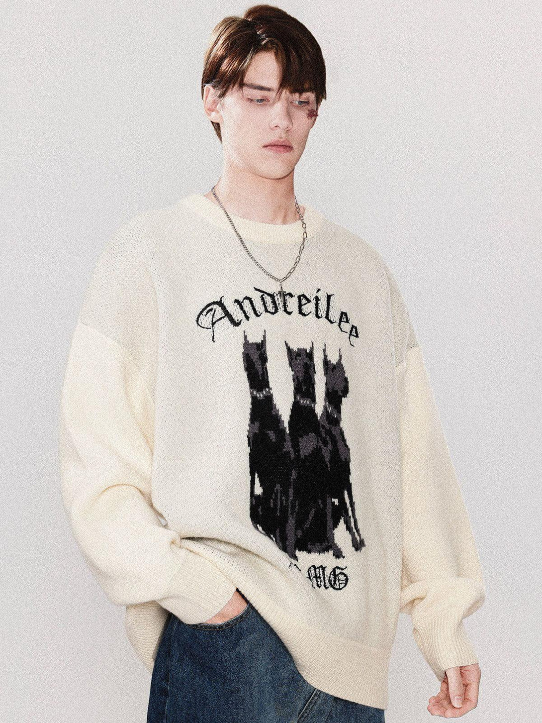 Model wearing TALISHKO Doberman print sweater, showcasing a bold graphic design with a casual fit.