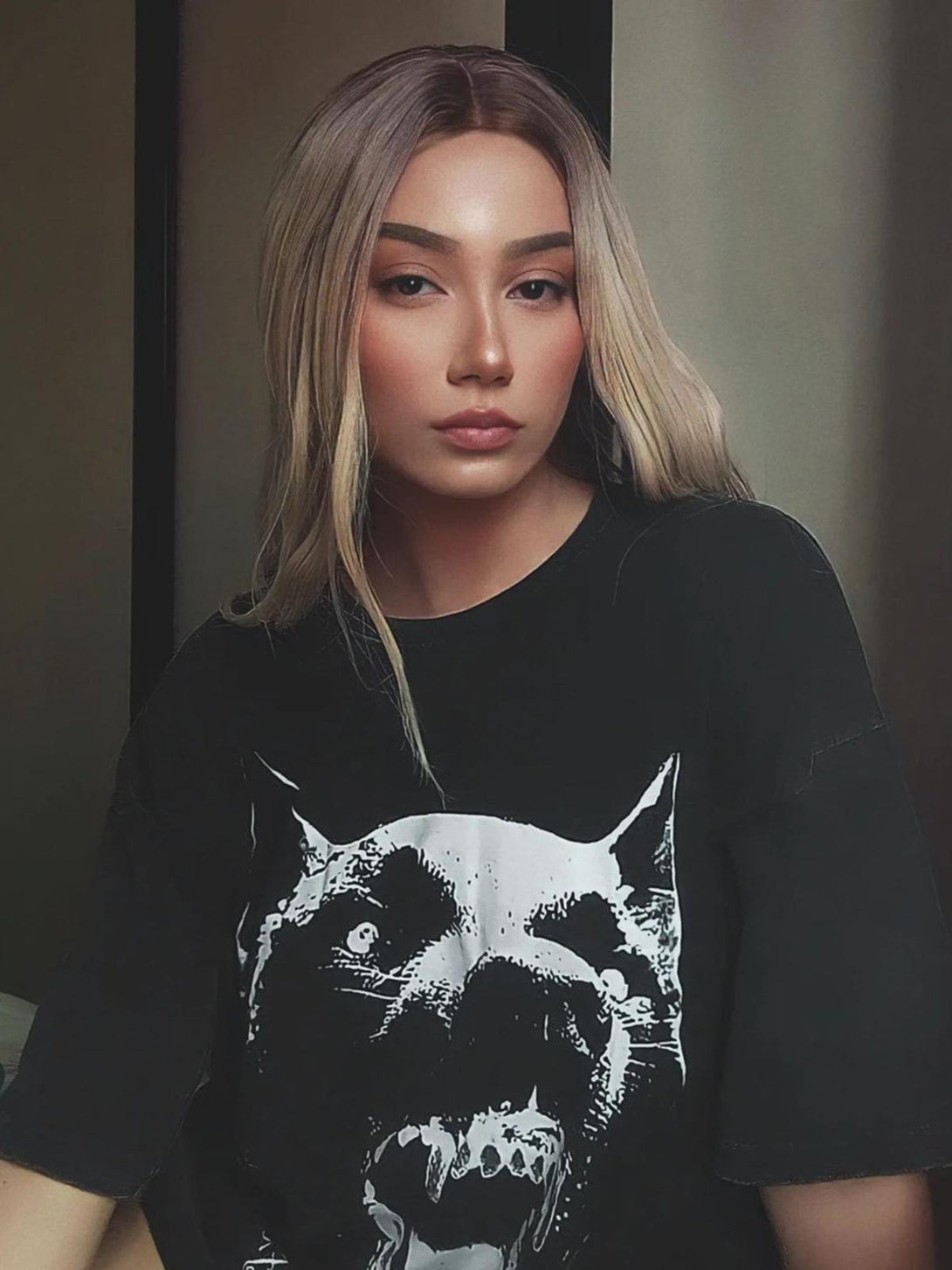 Model wearing TALISHKO's washed black t-shirt with bold Doberman print, exuding edgy style.