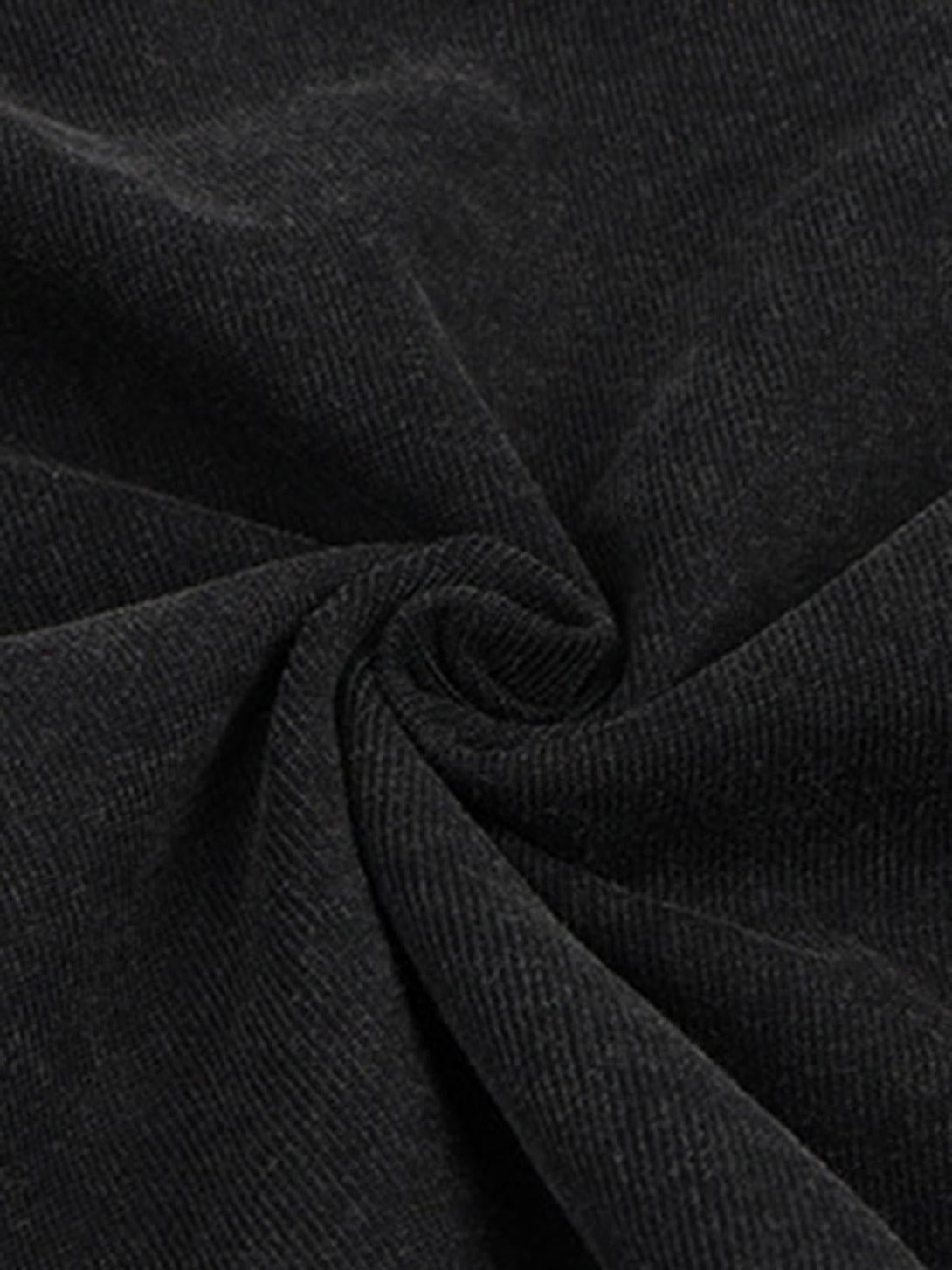 A tight crop highlighting TALISHKO's vintage T-shirt fabric and its rich, washed texture.