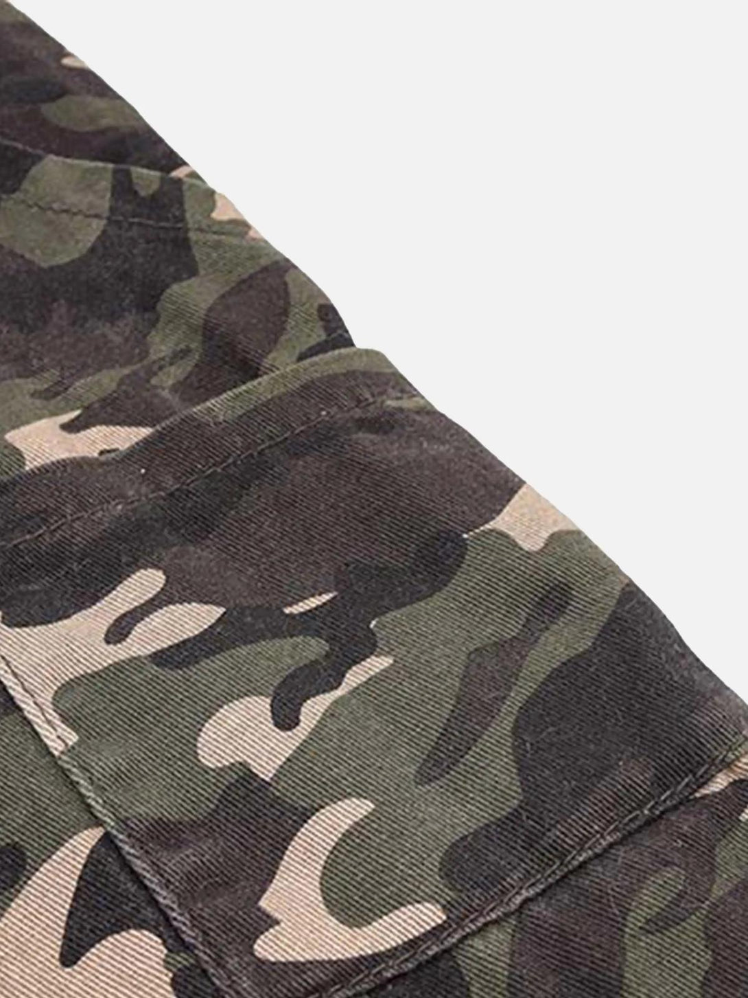 Detailed fabric and stitching on TALISHKO camouflage pants, emphasizing the unique design.