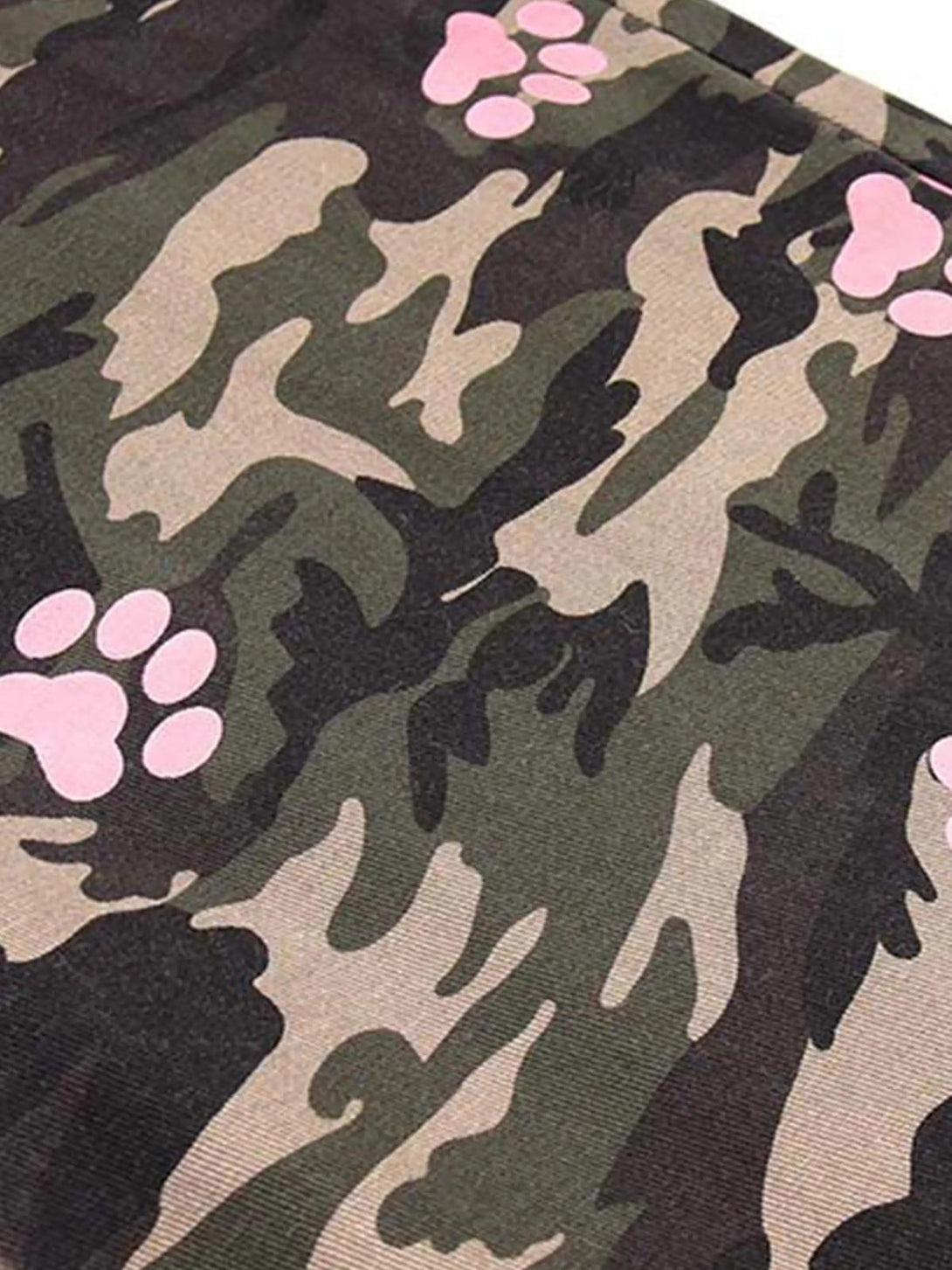 Intricate look at TALISHKO camouflage pants, featuring stylish pink paw print accents.