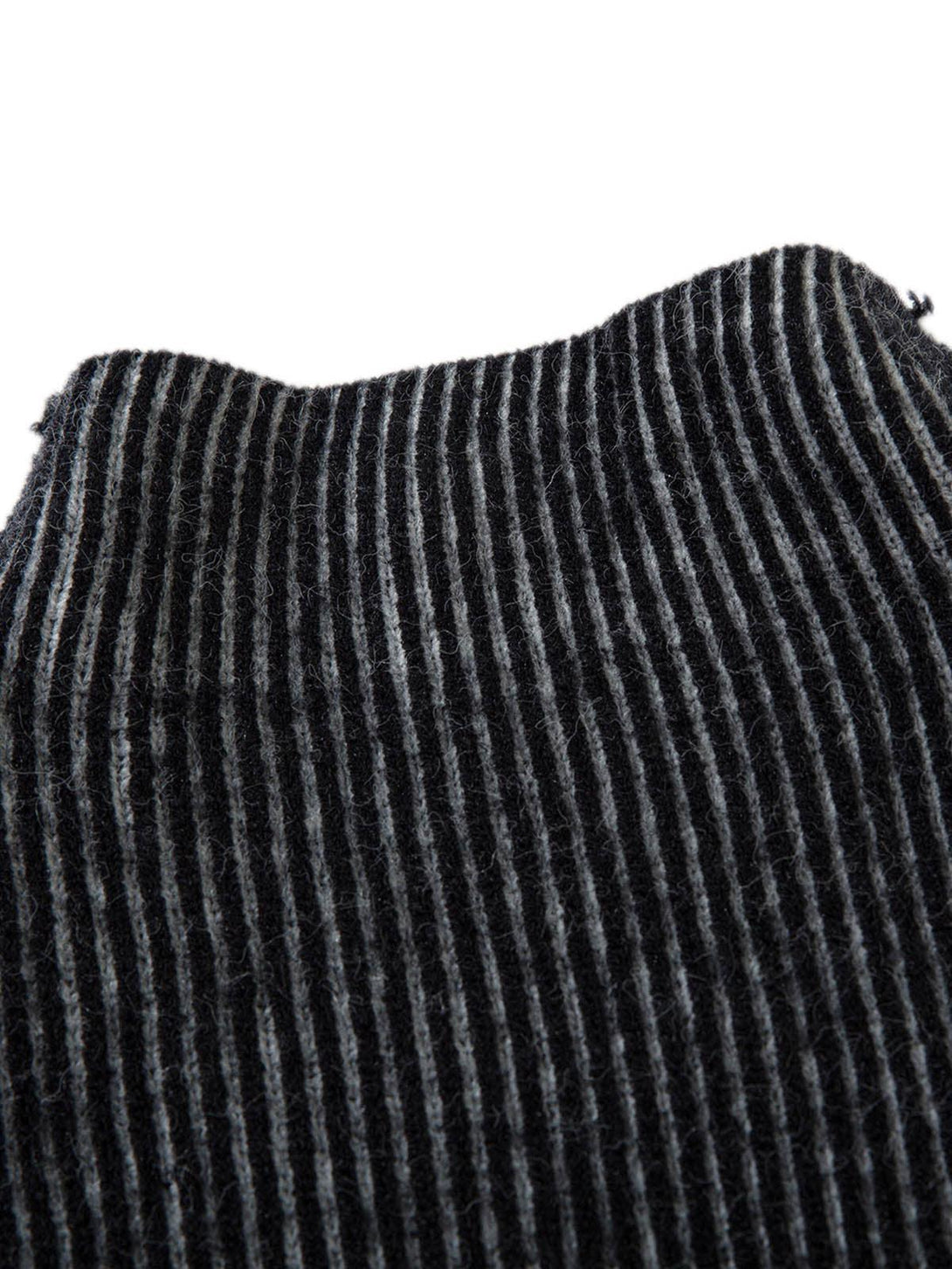 Detailed view of TALISHKO's sweater, highlighting the ribbed texture and striped pattern.