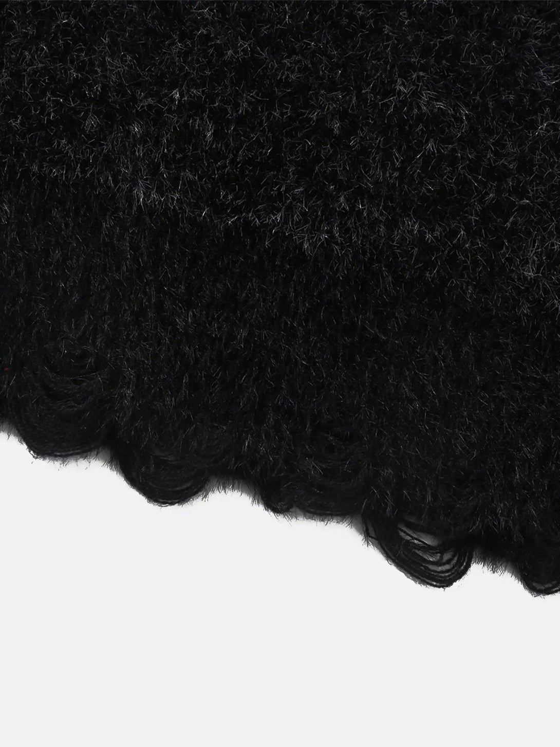 Zoomed-in texture of the Dragon Mohair Jacquard Sweater by TALISHKO, highlighting its soft fibers.