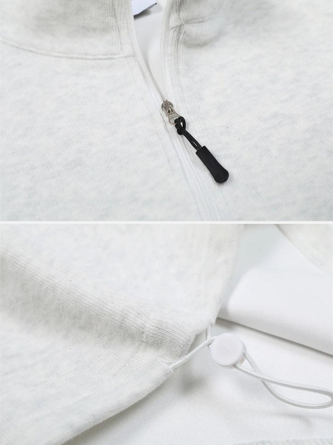 A detailed look at the white stand collar sweatshirt's zipper and drawstring hem by TALISHKO.
