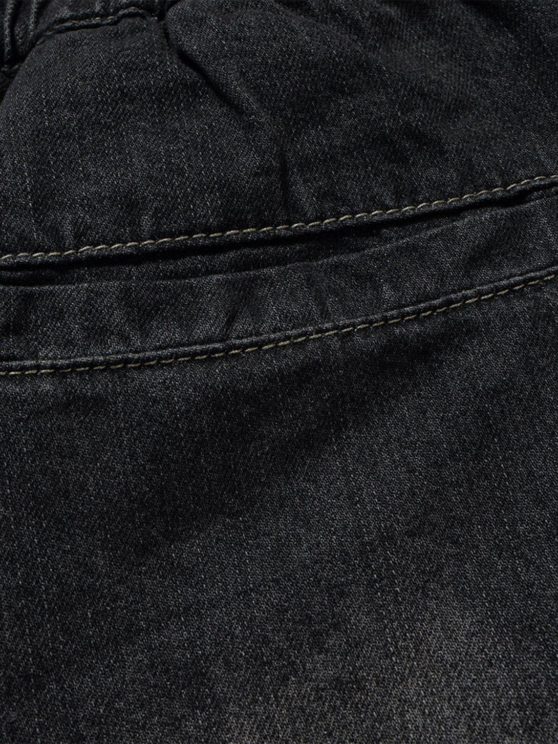Detailed fabric and stitching on TALISHKO's drawstring washed jorts, highlighting texture.