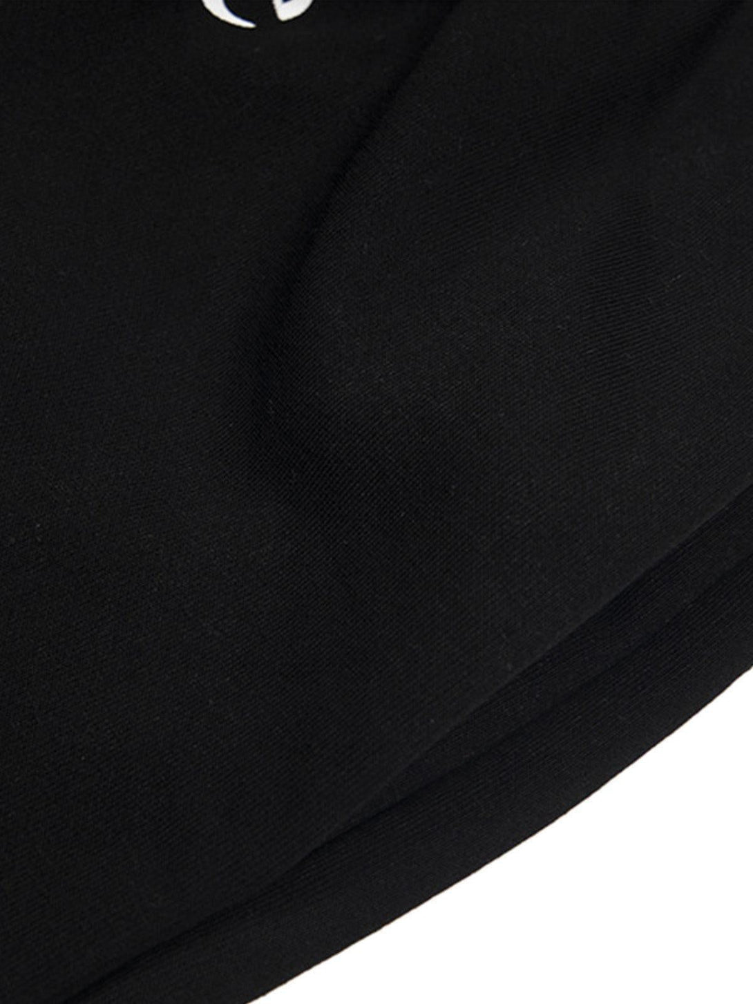 Focusing on the smooth fabric and subtle design of TALISHKO's black elastic shorts.