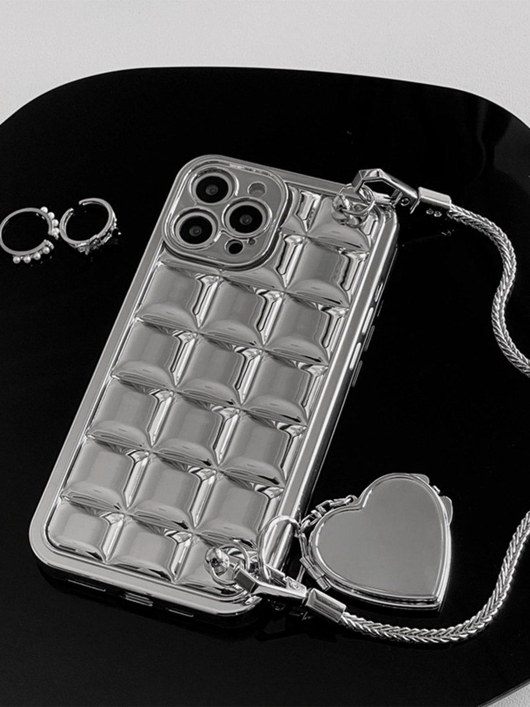 TALISHKO mobile case with electroplate block design and heart chain, showcasing sleek style.
