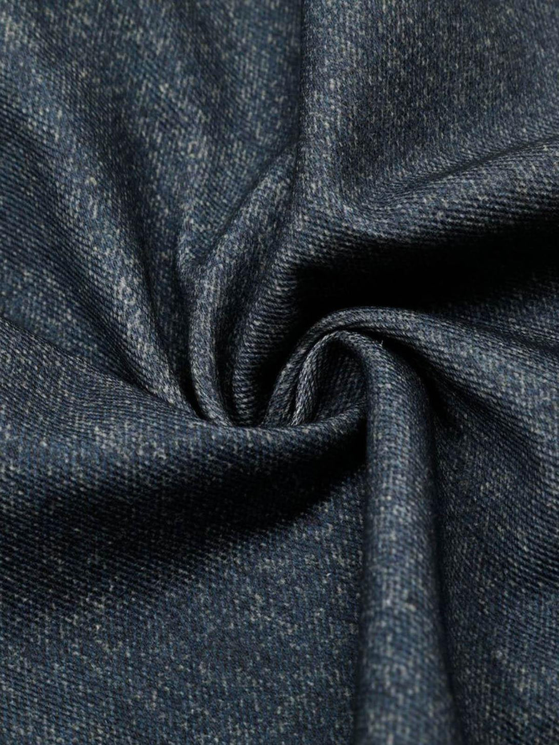 Texture and pattern showcased in TALISHKO denim fabric, highlighting intricate detail.