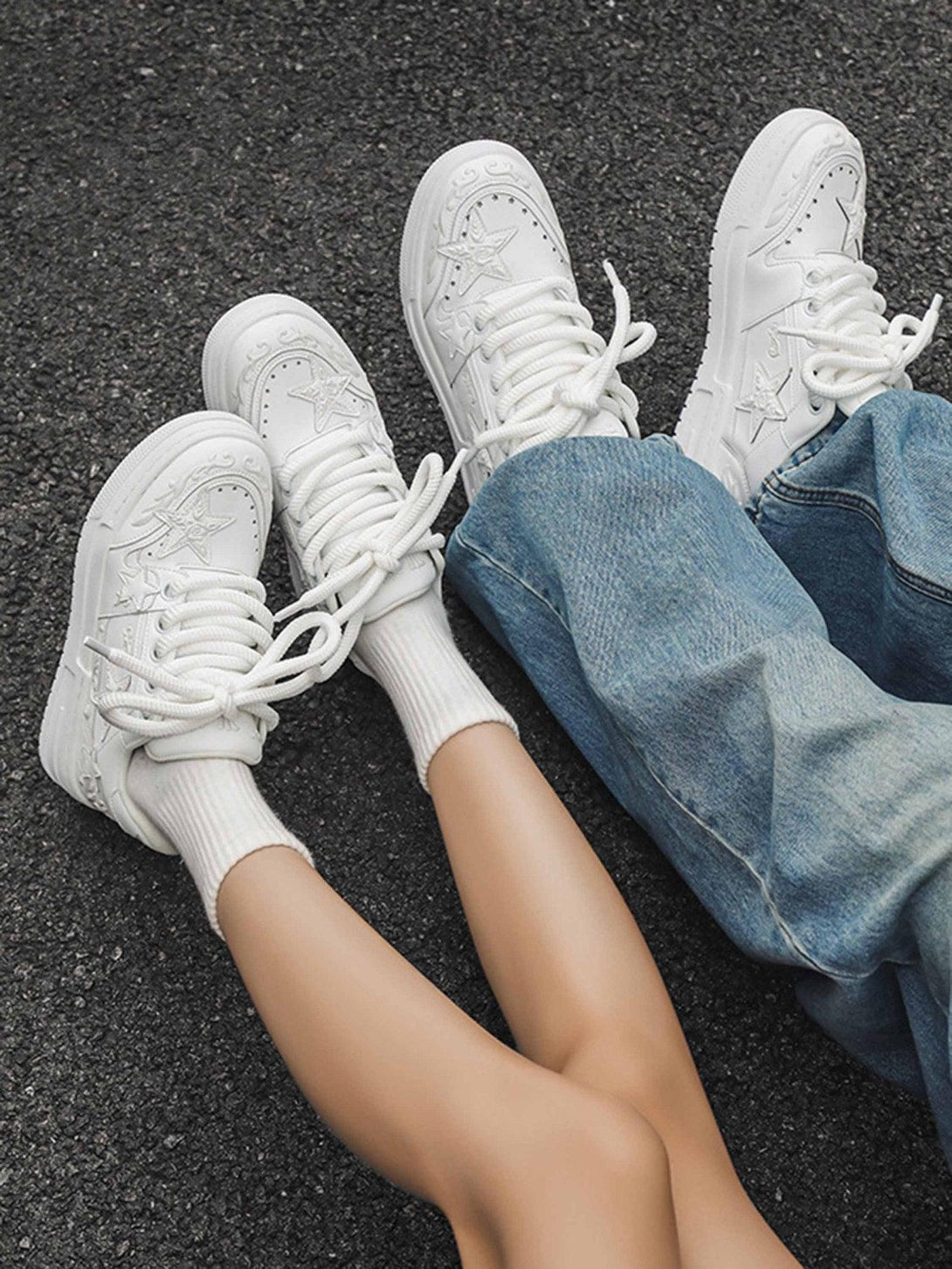 White embossed star board shoes by TALISHKO, styled with casual denim for a relaxed vibe.