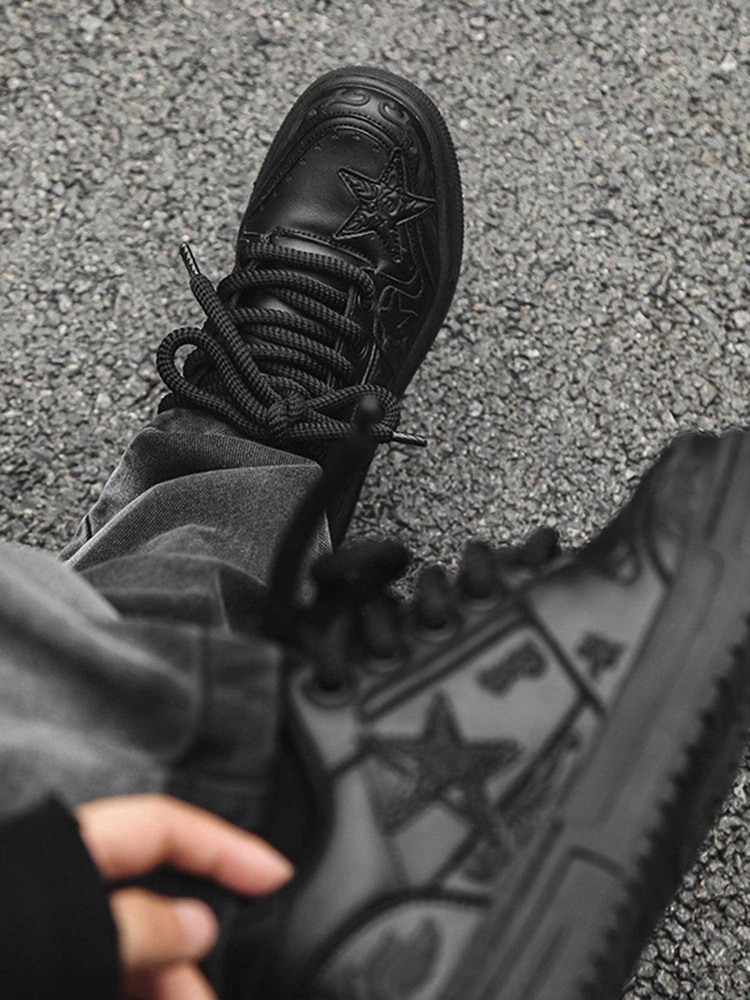 A detailed view of TALISHKO's embossed stars on casual board shoes, showcasing unique texture.