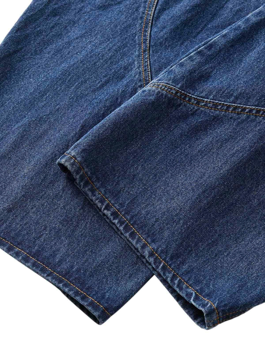 Detailed fabric and stitching on TALISHKO's embroidered barrel leg jeans, emphasizing texture.