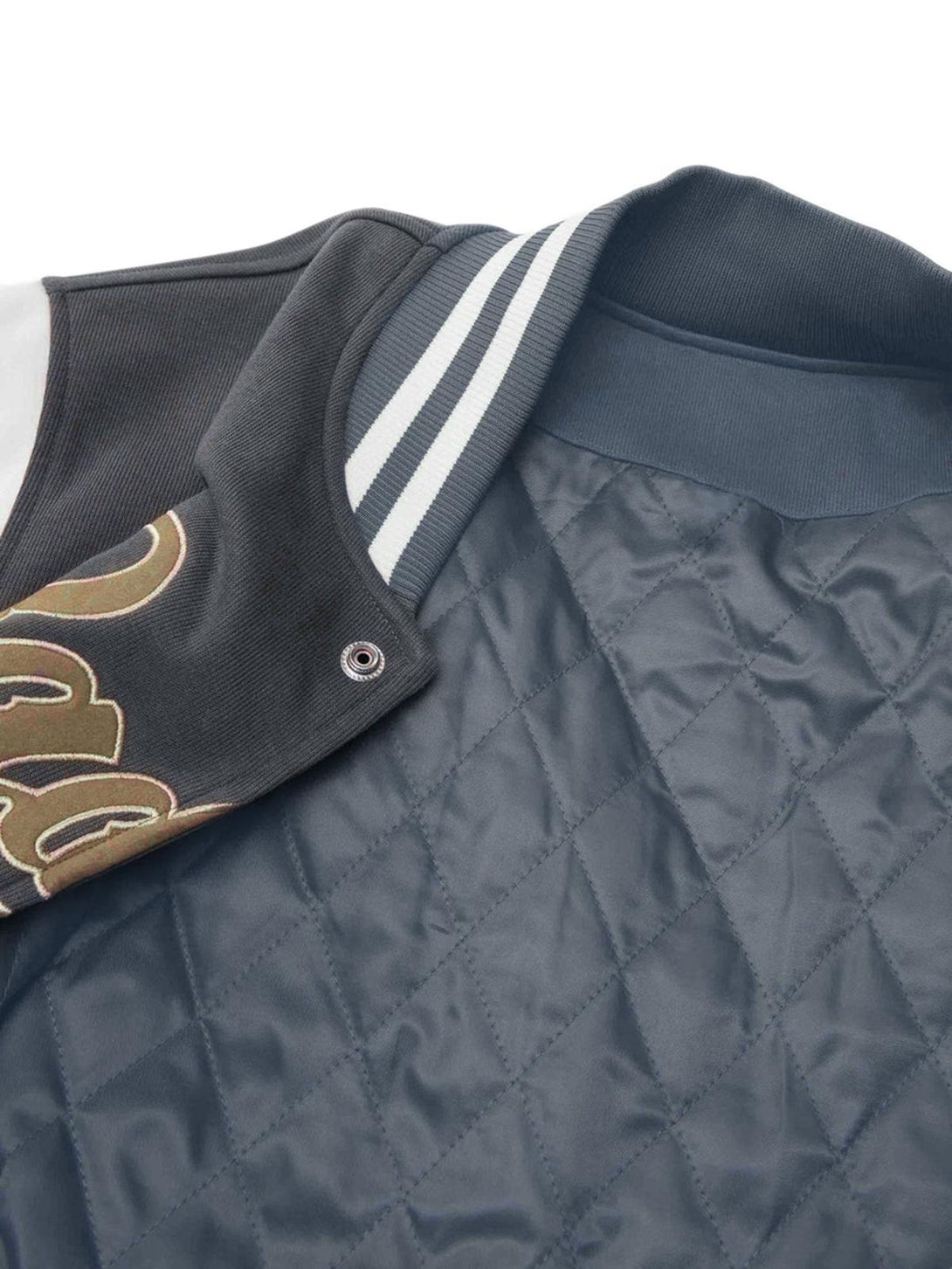 Quilted interior of the TALISHKO embroidered bomber jacket, highlighting cozy insulation.