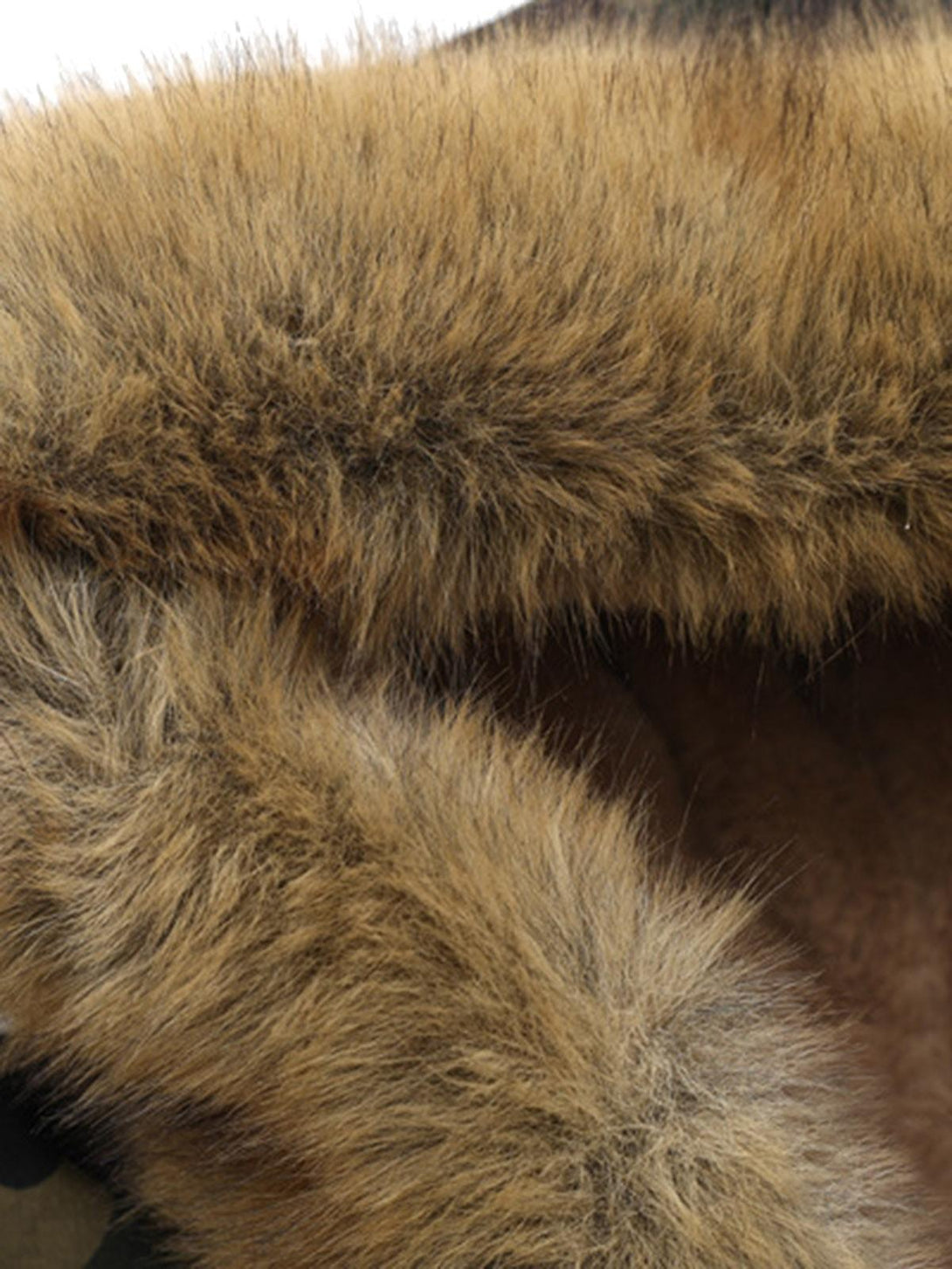 "Zoomed-in texture of the detachable fur hood, showcasing TALISHKO's attention to detail."
